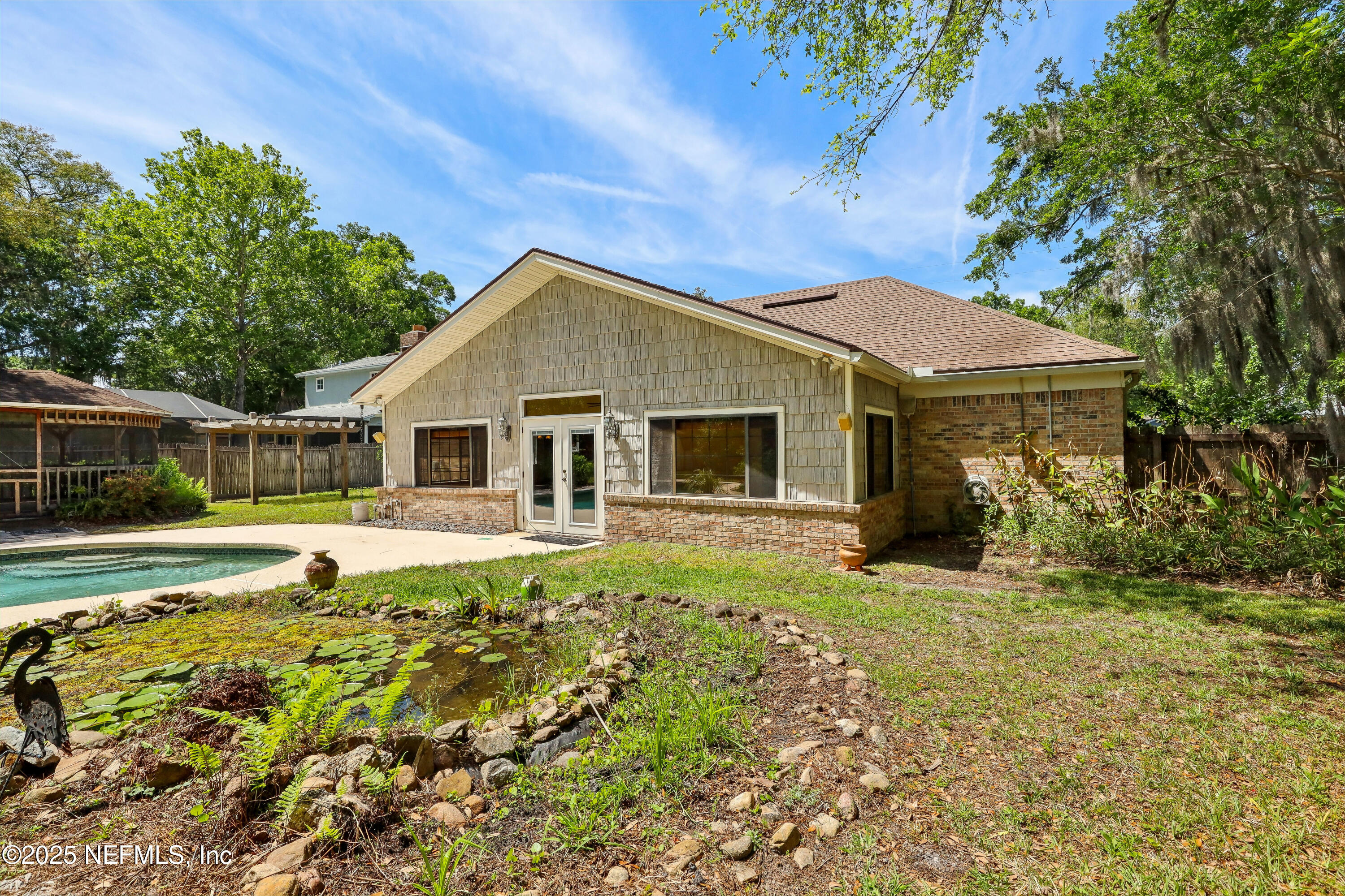 1071 Orangewood Road St. Johns, FL 32259 - Photo 51 of 56 a view of a white house with a yard