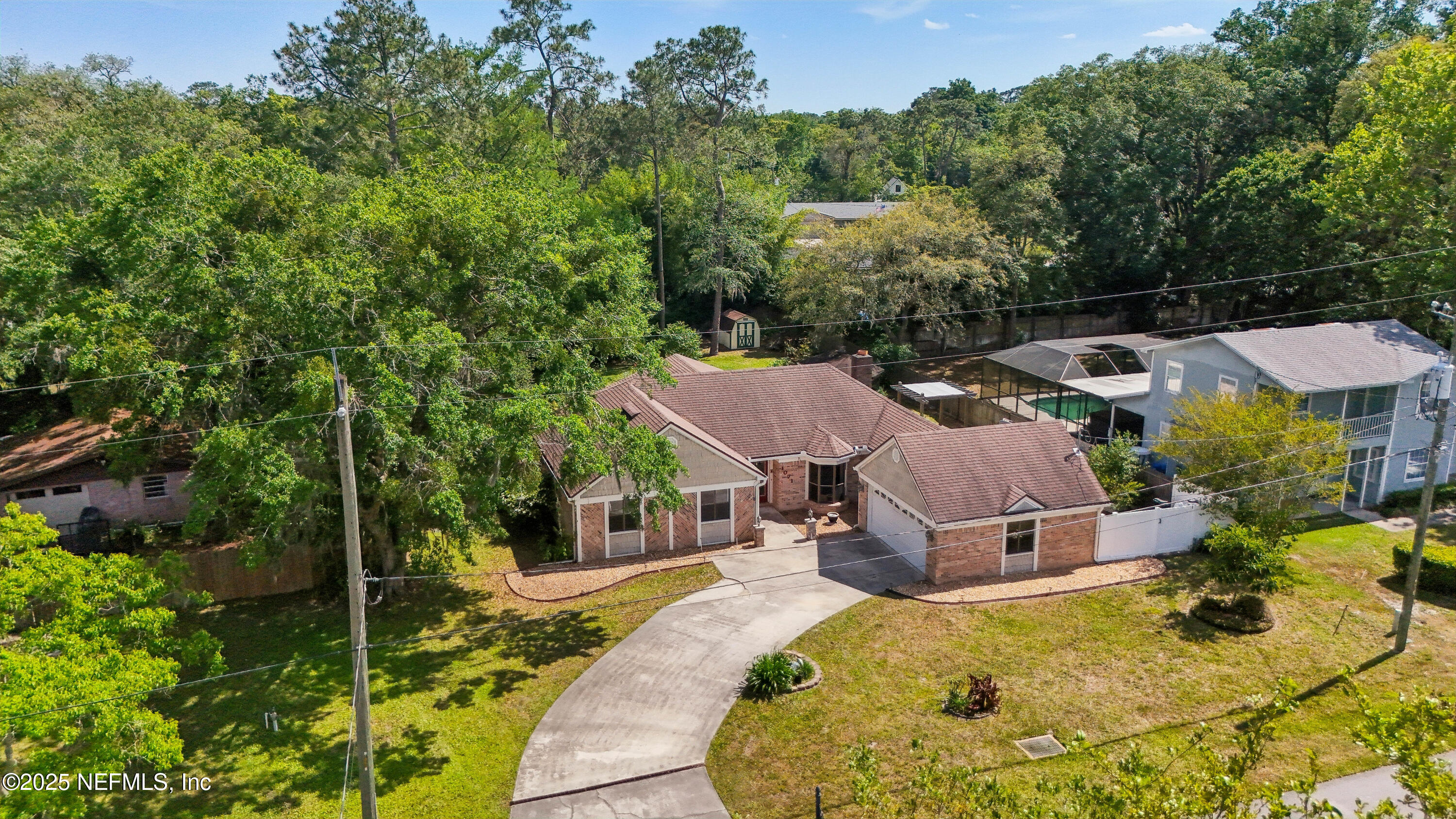 1071 Orangewood Road St. Johns, FL 32259 - Photo 53 of 56 an aerial view of a house with swimming pool and garden