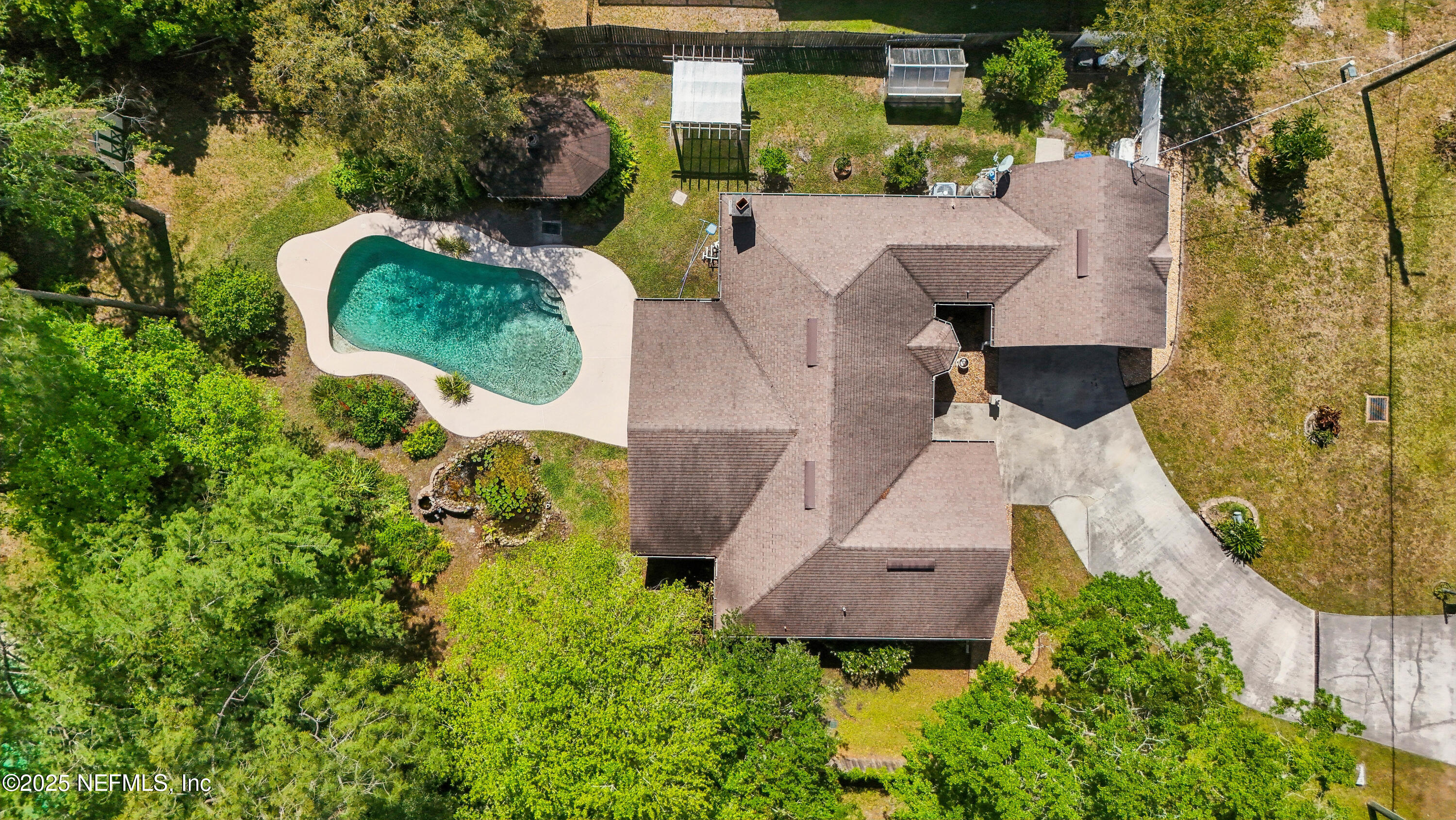 1071 Orangewood Road St. Johns, FL 32259 - Photo 55 of 56 an aerial view of a house with swimming pool and outdoor space