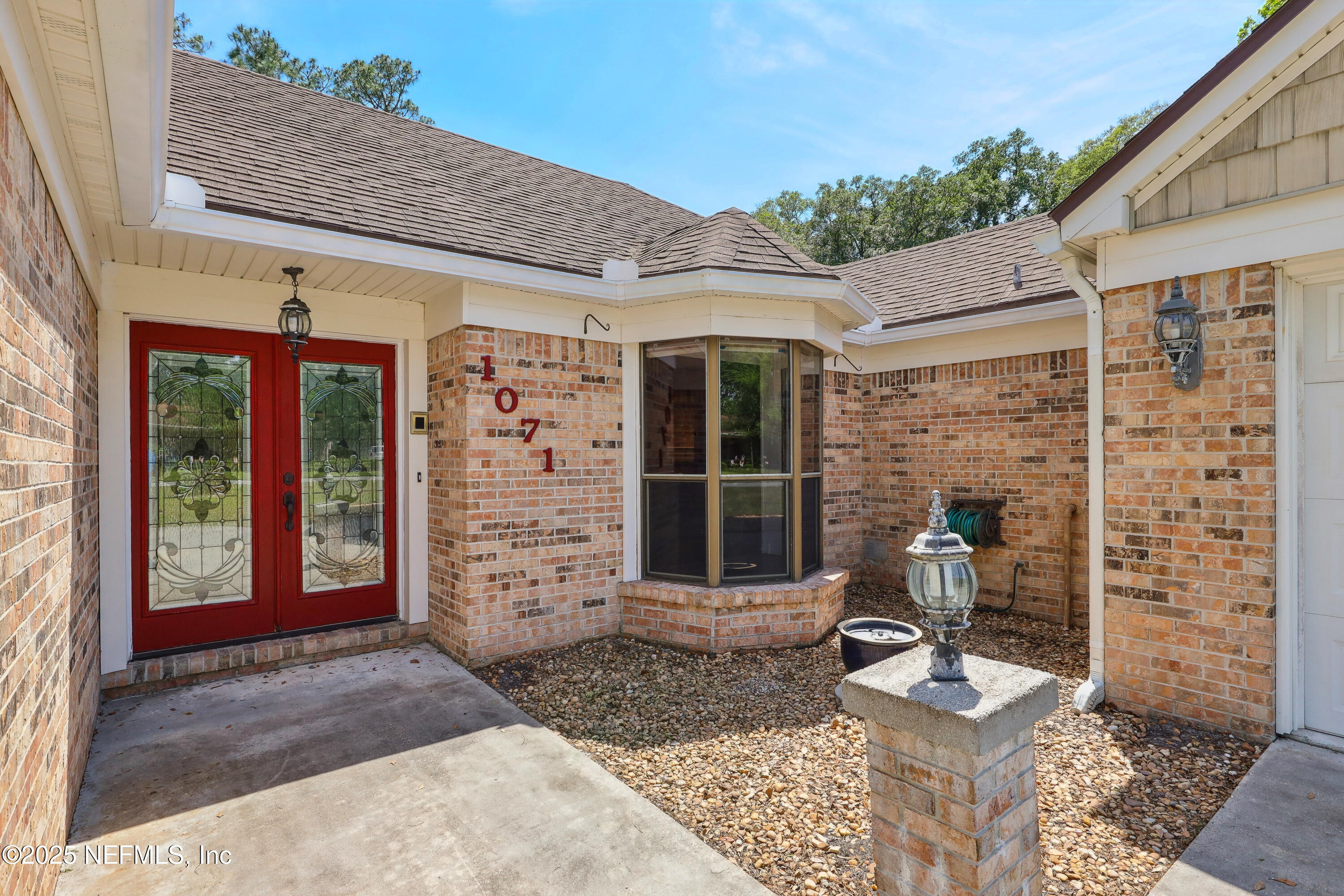 1071 Orangewood Road St. Johns, FL 32259 - Photo 6 of 56 a front view of a house with a large window