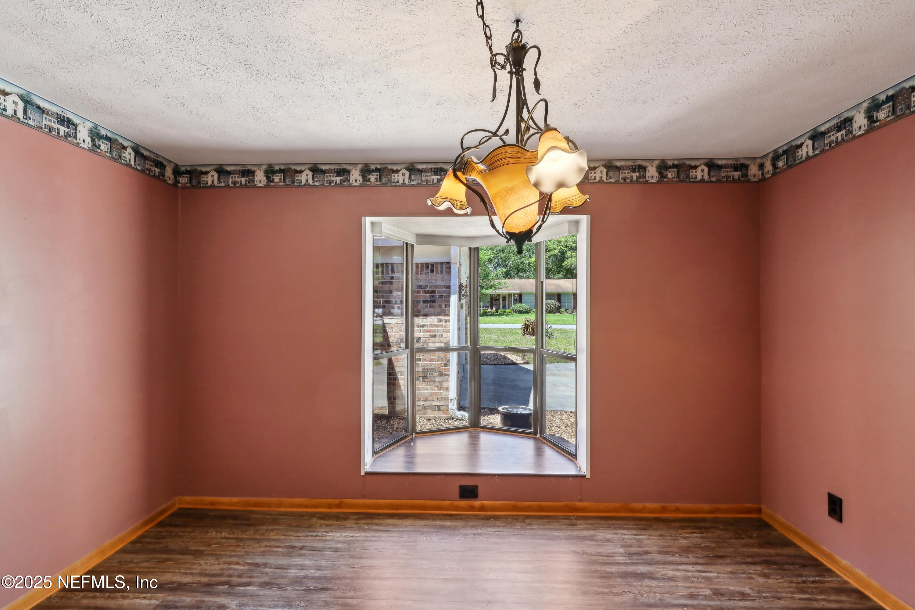 1071 Orangewood Road St. Johns, FL 32259 - Photo 10 of 56 a view of a room with wooden floor and windows