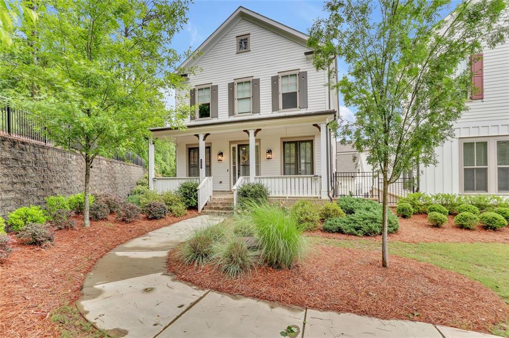 737 Farmstead Road Suwanee, GA 30024 - Photo 1 of 1 a front view of a house with a yard