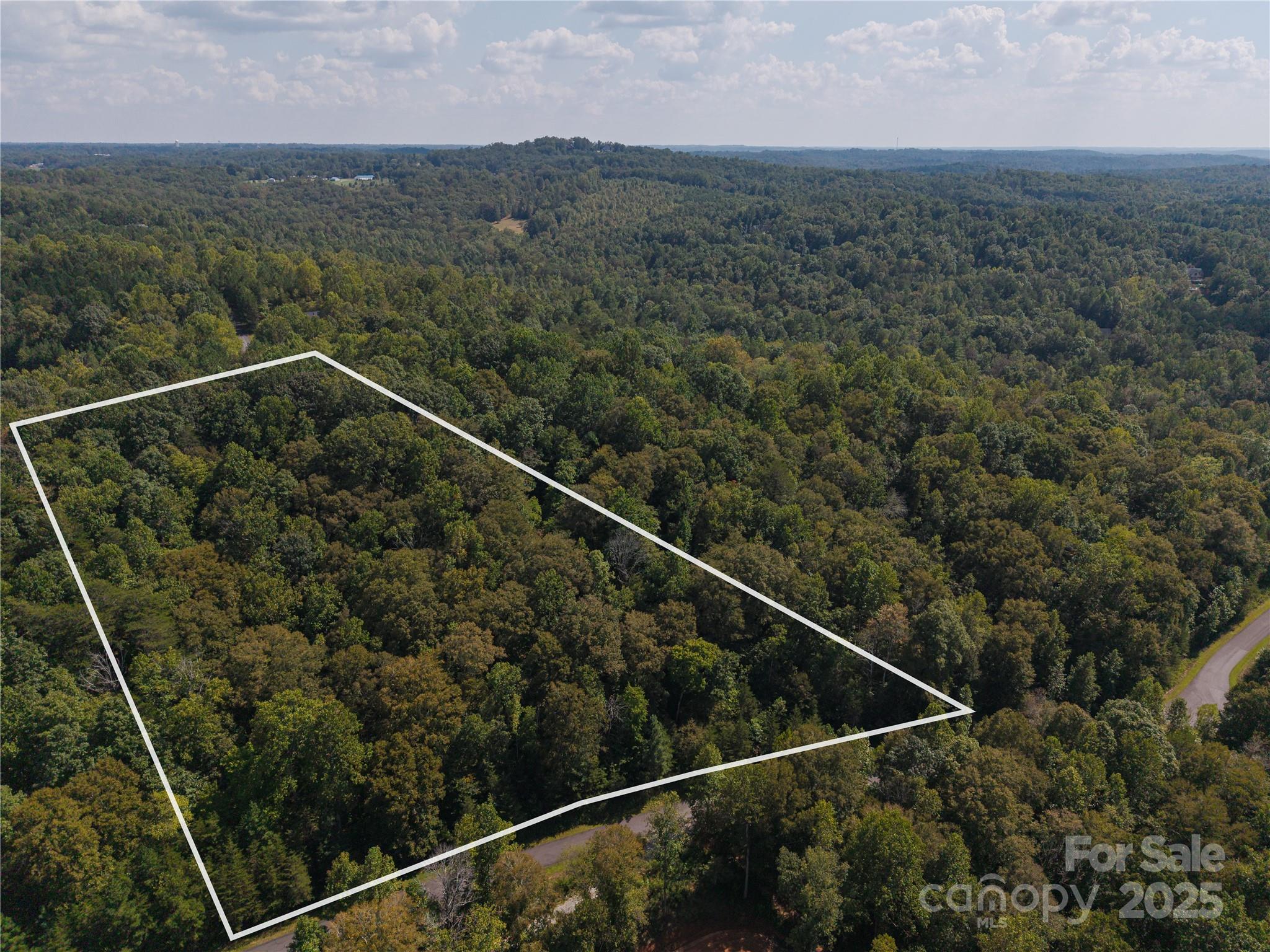 0 Creekside Circle, Unit 135 Rutherfordton, NC 28139 - Photo 2 of 7 a view of a city from a balcony with a forest