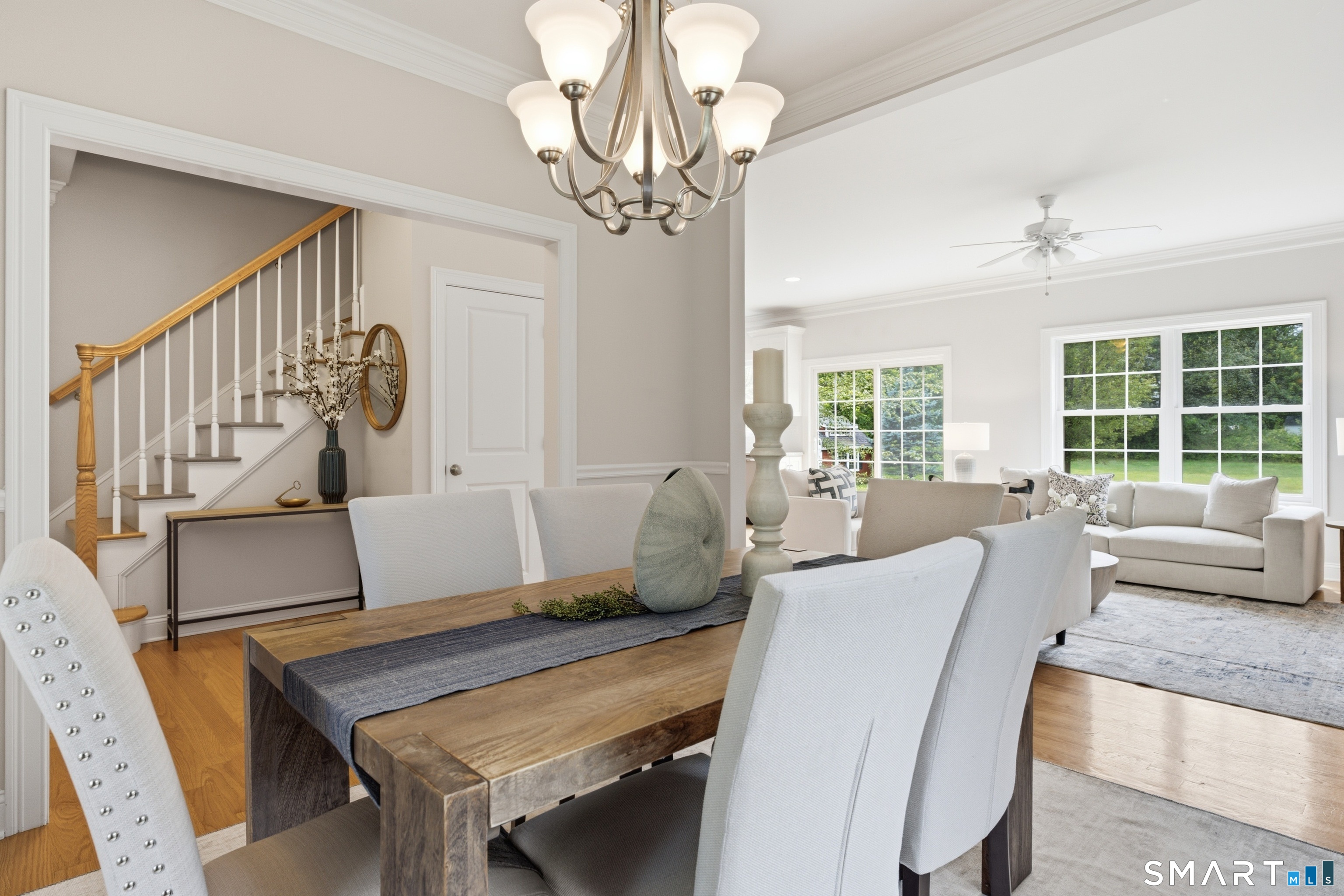 838 Little Meadow Road Guilford, CT 06437 - Photo 5 of 40 The dining room is open to the action but is set off and clearly defined with a lovely chandelier and plenty of seating.
