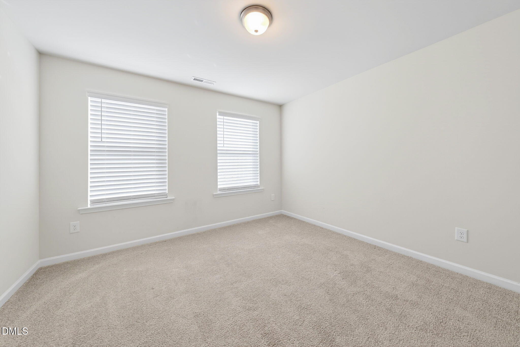 211 Kineton Woods Way Garner, NC 27529 - Photo 13 of 18 an empty room with windows