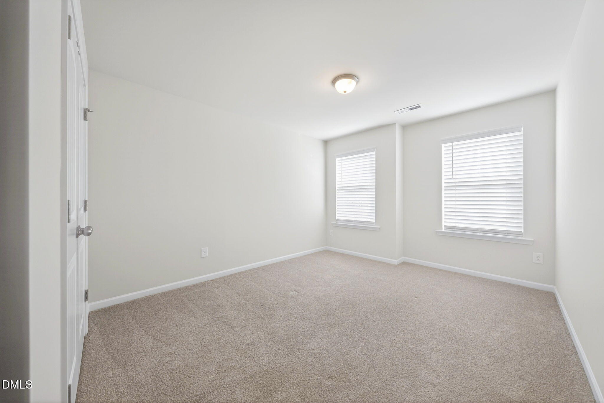 211 Kineton Woods Way Garner, NC 27529 - Photo 14 of 18 an empty room with windows