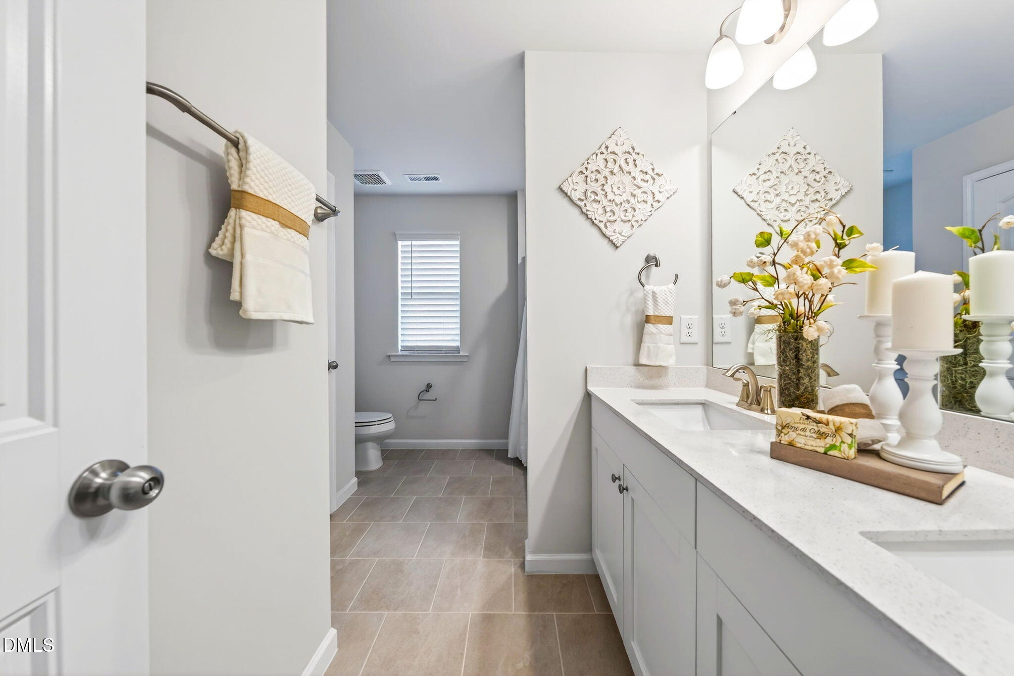 211 Kineton Woods Way Garner, NC 27529 - Photo 15 of 18 a spacious bathroom with a sink mirror and vanity