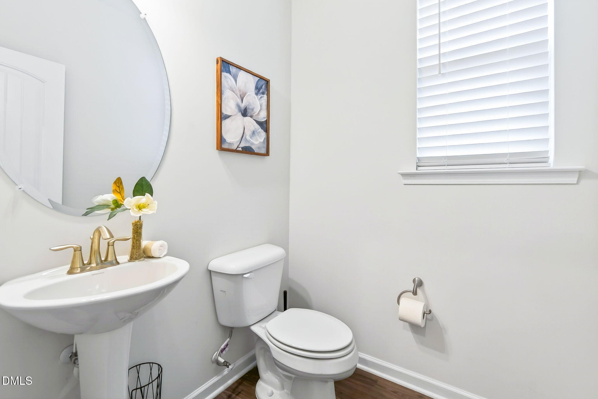 211 Kineton Woods Way Garner, NC 27529 - Photo 9 of 18 a bathroom with a toilet sink and mirror