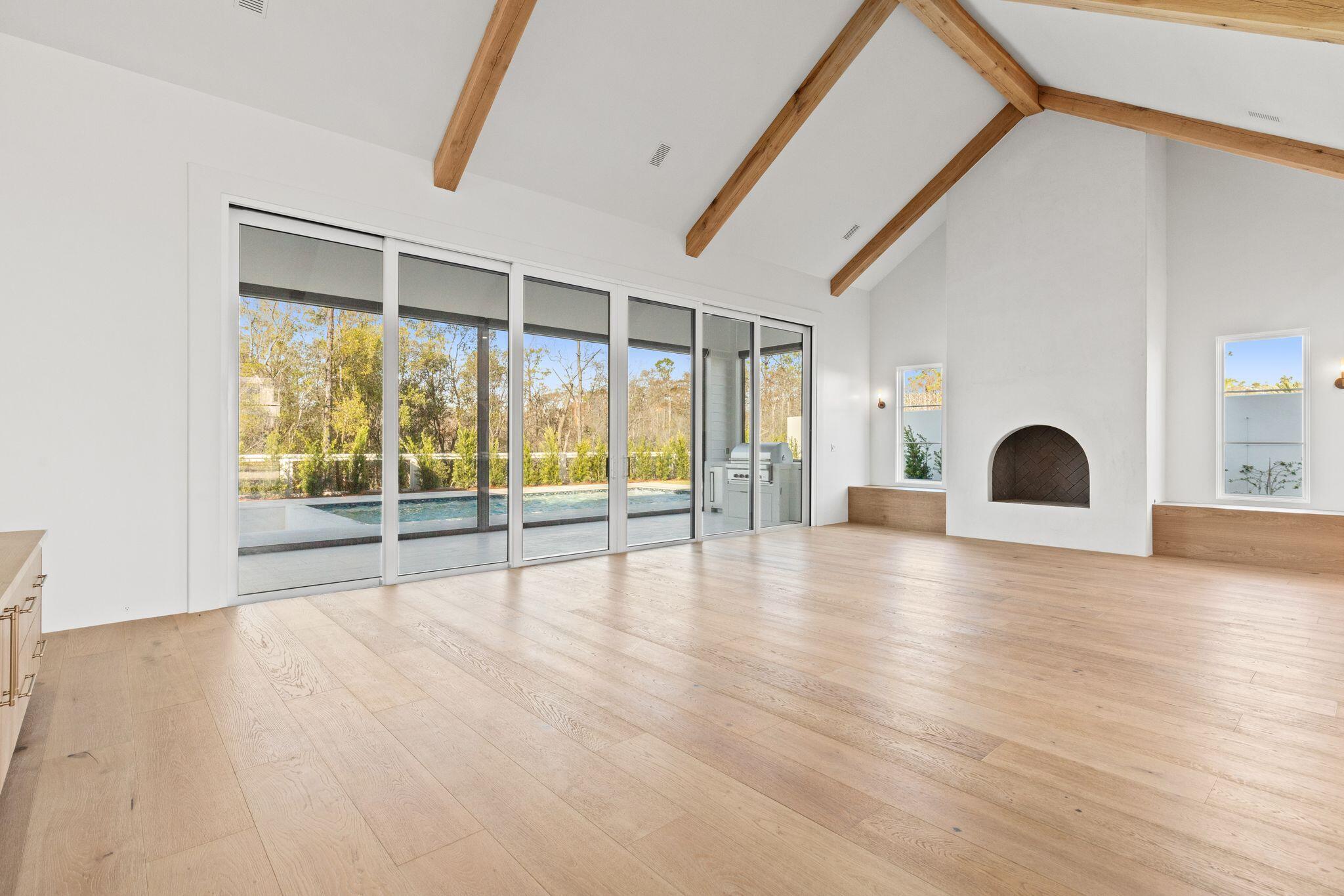 89 Quail Hollow Inlet Beach, FL 32461 - Photo 22 of 75 a view of an empty room with wooden floor and a window