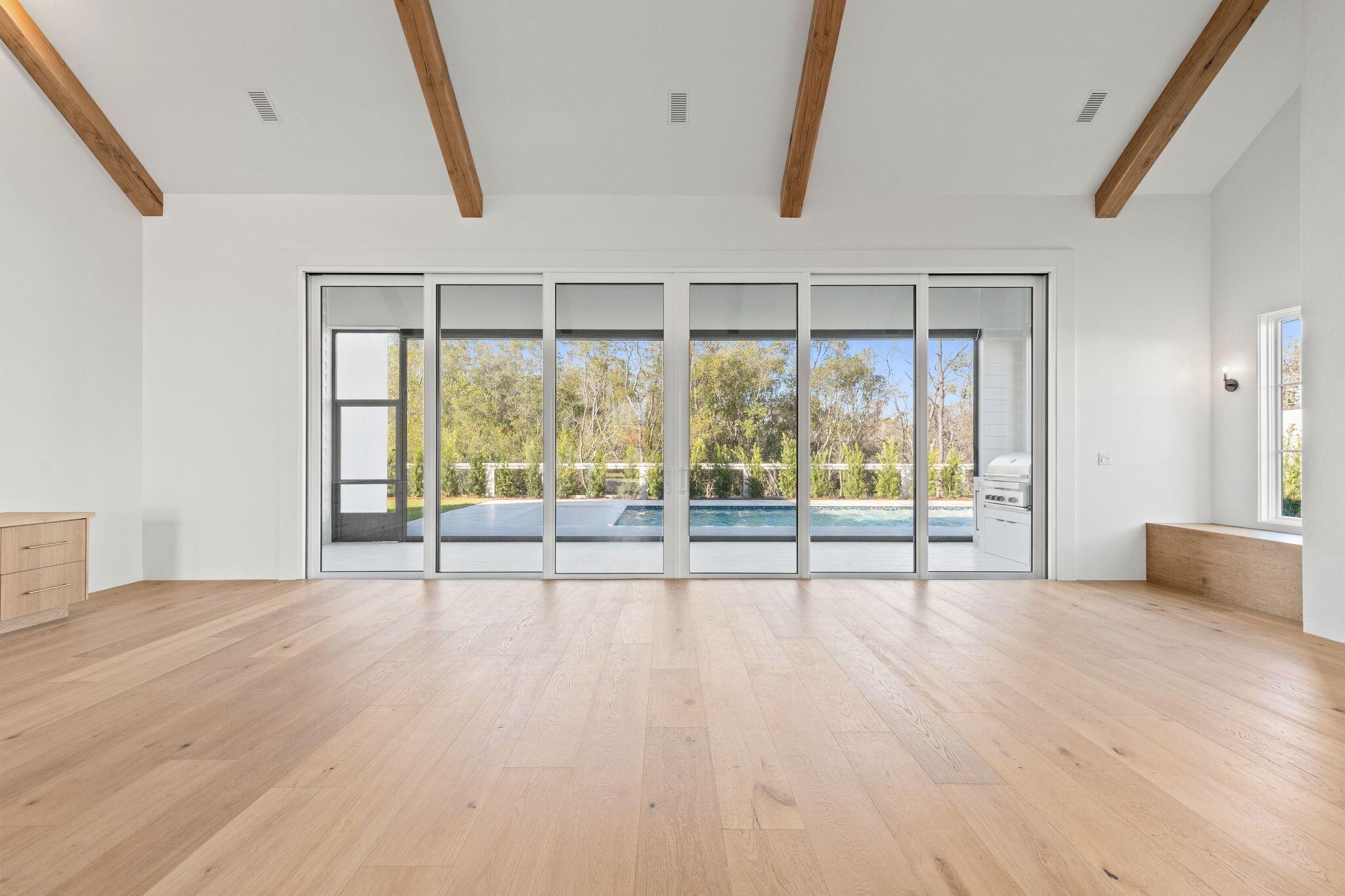 89 Quail Hollow Inlet Beach, FL 32461 - Photo 23 of 75 a view of an empty room with wooden floor and a window