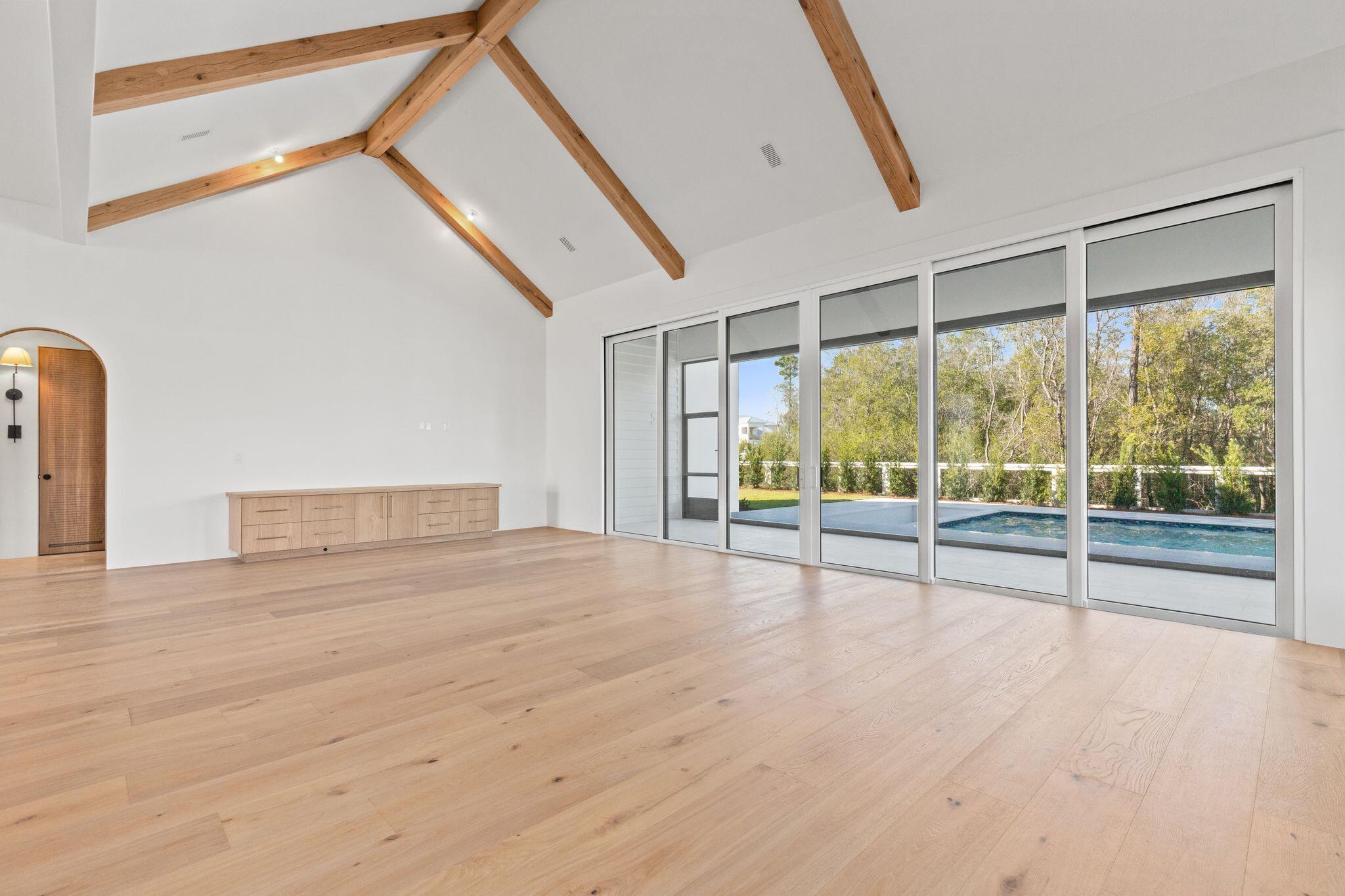 89 Quail Hollow Inlet Beach, FL 32461 - Photo 24 of 75 a view of an empty room with wooden floor and windows