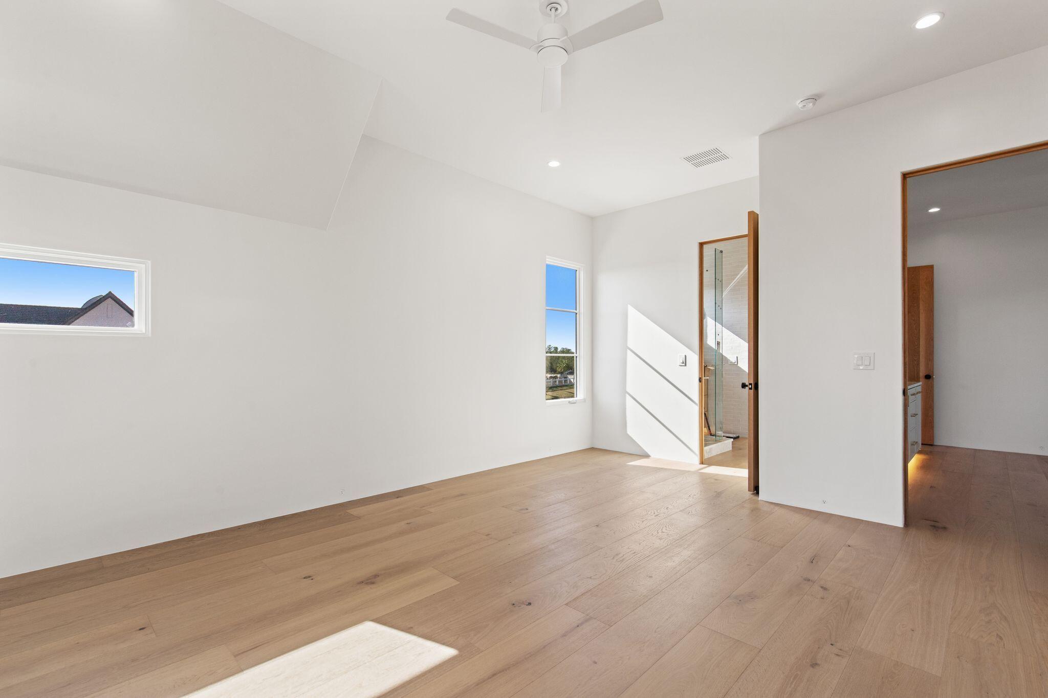 89 Quail Hollow Inlet Beach, FL 32461 - Photo 49 of 75 a view of an empty room with wooden floor and a window
