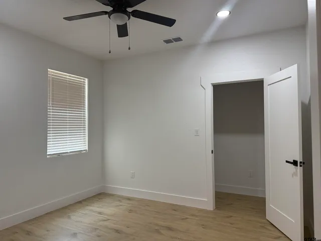 a kitchen with white cabinets and a sink
