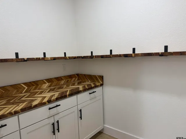 a kitchen with stainless steel appliances granite countertop a sink and a stove