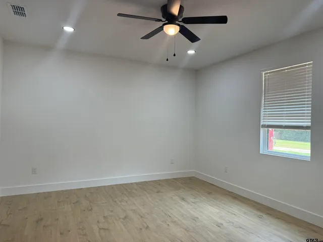 a kitchen with granite countertop a stove and a sink