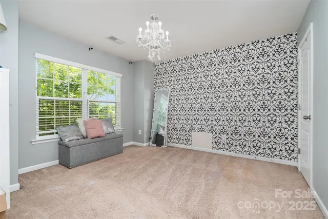 a living room with a couch and a large window