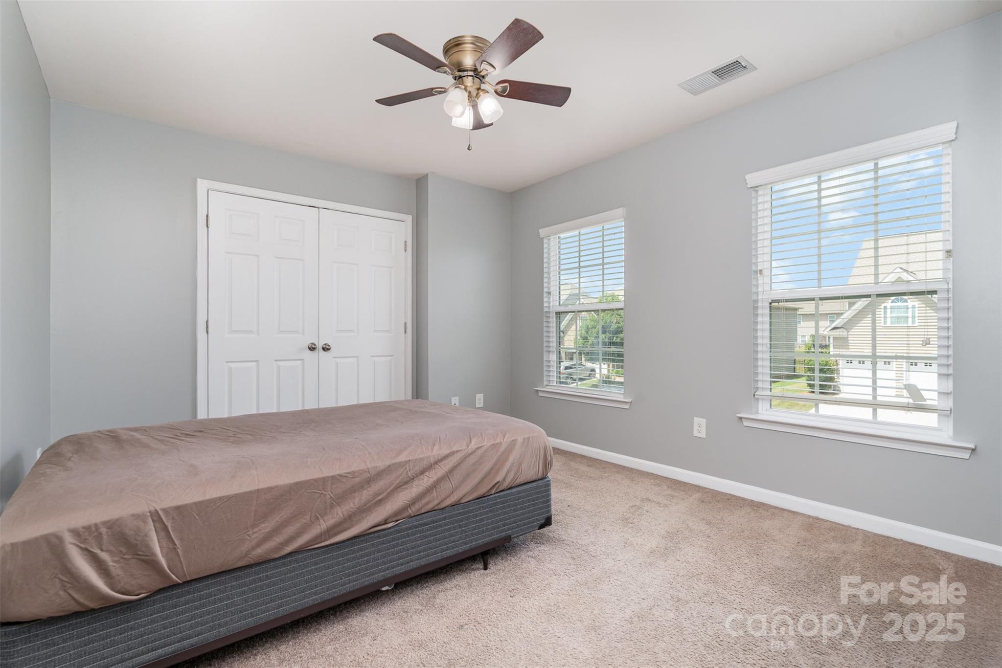 8931 Happiness Road Harrisburg, NC 28075 - Photo 19 of 32 a bedroom with a bed and a window