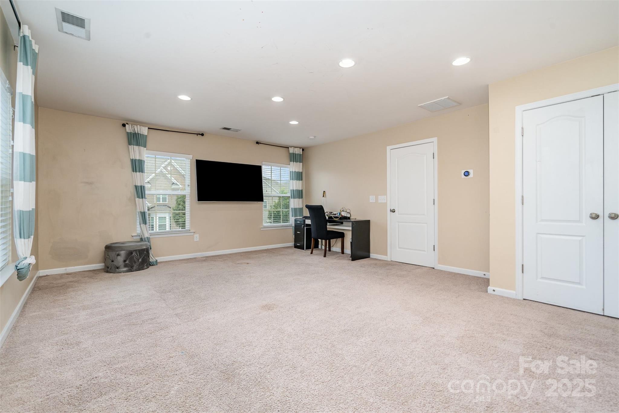 8931 Happiness Road Harrisburg, NC 28075 - Photo 21 of 32 an empty room with furniture and white walls