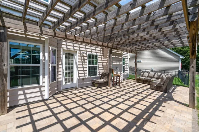 a balcony with chairs and table