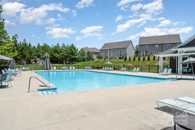 a view of a swimming pool with a lounge chair