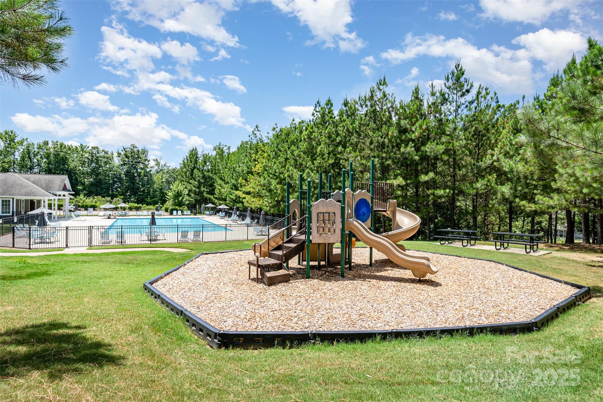 8931 Happiness Road Harrisburg, NC 28075 - Photo 29 of 32 a view of a park with swings