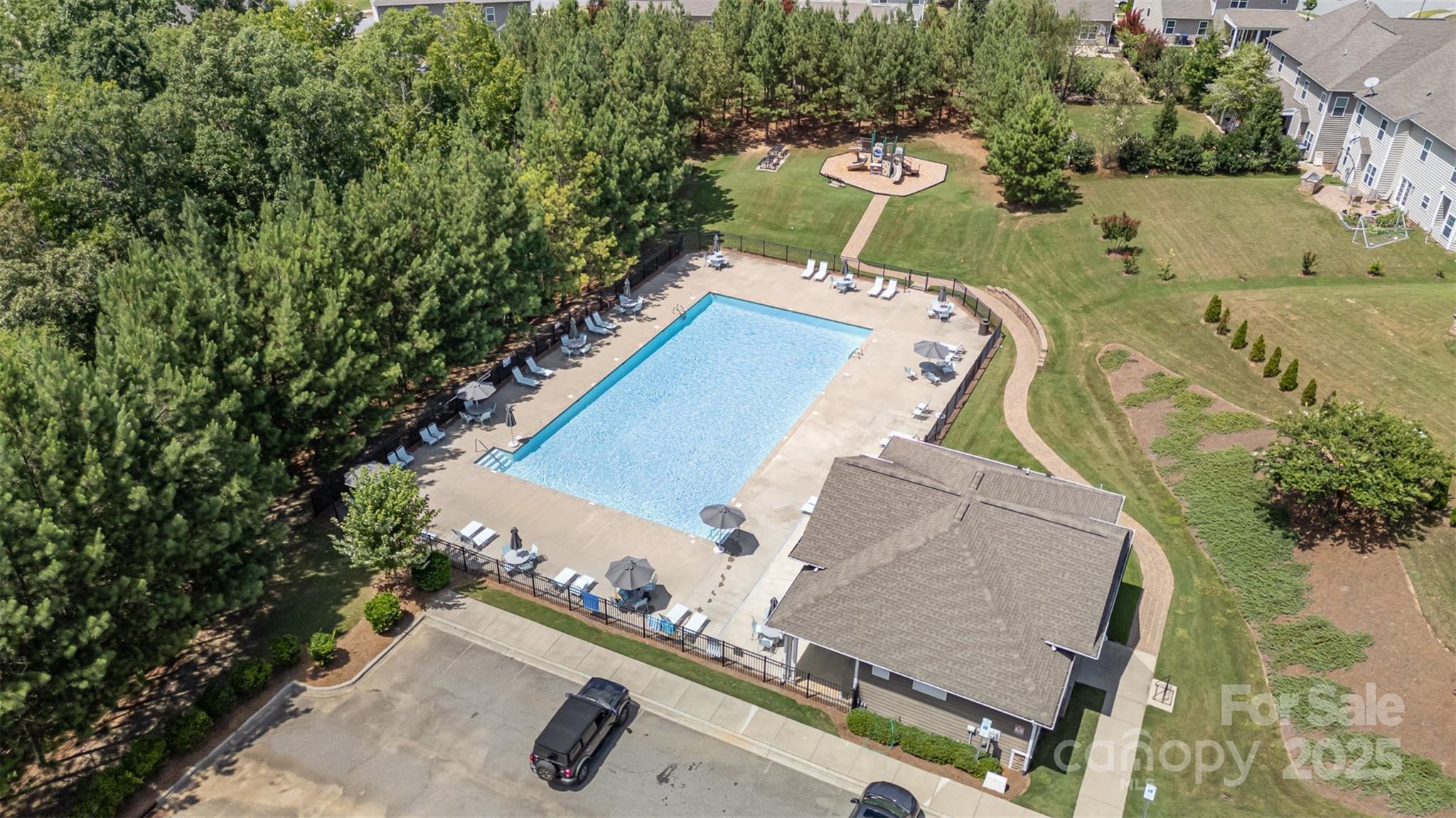 8931 Happiness Road Harrisburg, NC 28075 - Photo 32 of 32 an aerial view of a house with a yard and trees