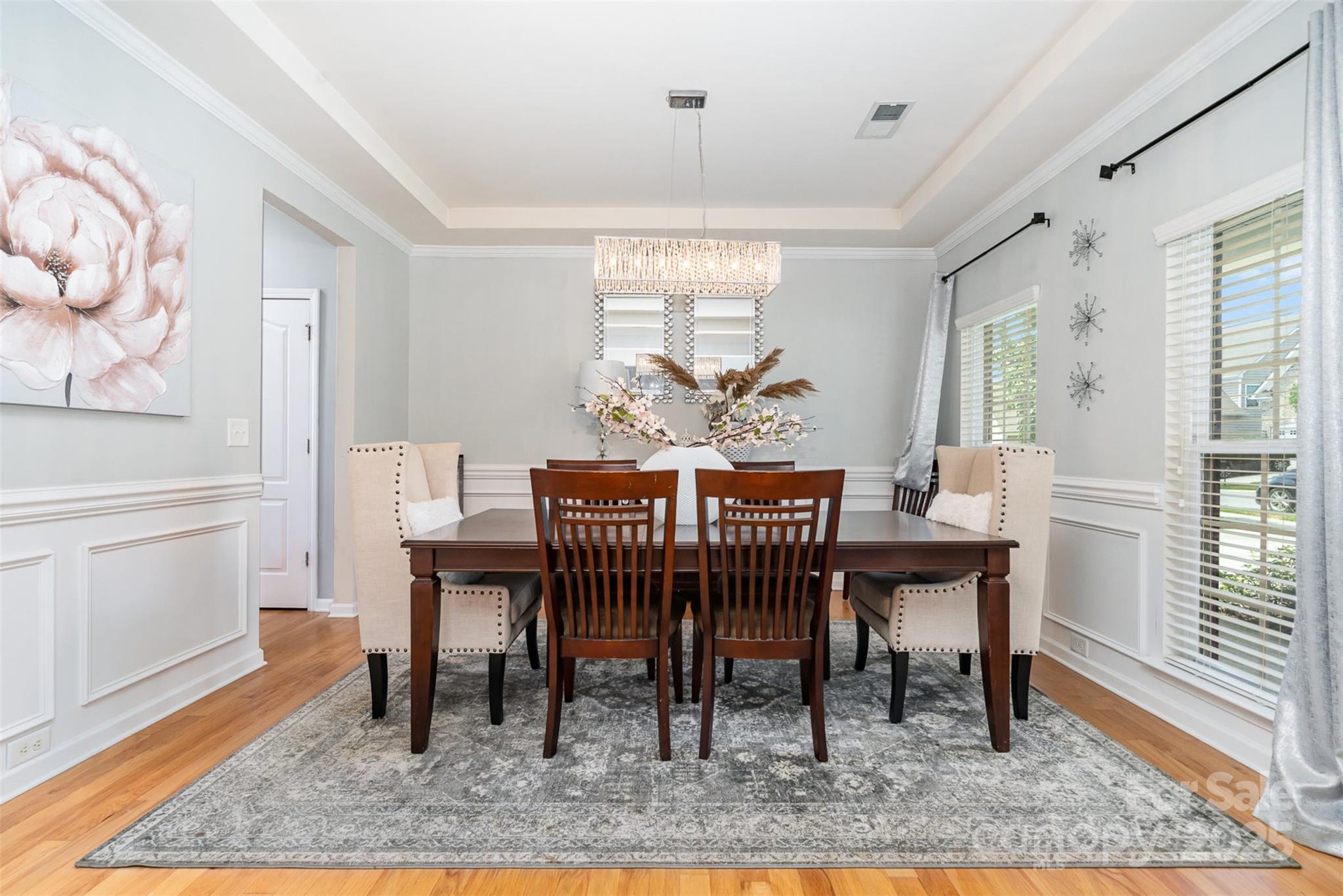 8931 Happiness Road Harrisburg, NC 28075 - Photo 9 of 32 a view of a dining room with furniture window and wooden floor