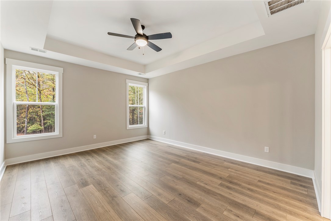 121 Falcon Crest Way Pickens, SC 29671 - Photo 9 of 13 This airy bedroom offers serene views and a comfortable atmosphere.