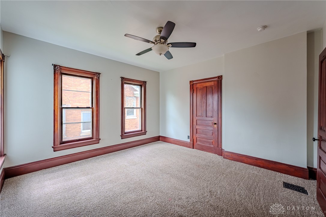 308 Yankee Road Middletown, OH 45044 - Photo 29 of 47 This spacious room offers comfort and potential, featuring rich wood trim and ample natural light.