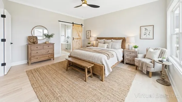 a spacious bedroom with a bed and a dresser