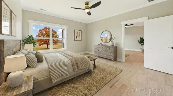 a spacious bedroom with a bed and a large window