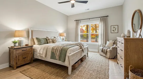 a bedroom with bed and window