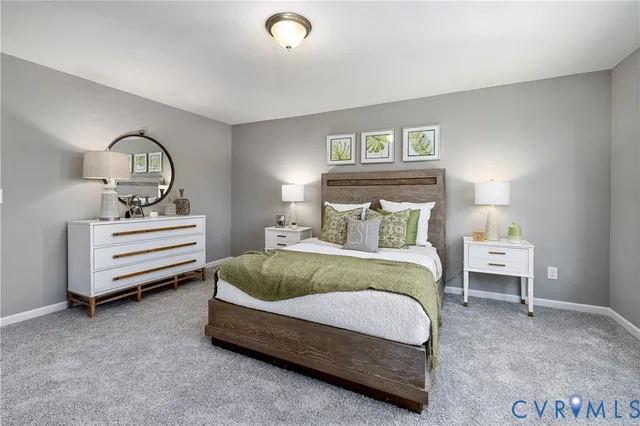 a bedroom with a bed and a night stand