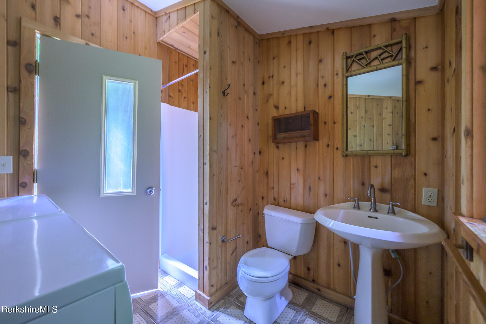 29 Lakeside Drive Tyringham, MA 01238 - Photo 16 of 31 a bathroom with a sink and a mirror