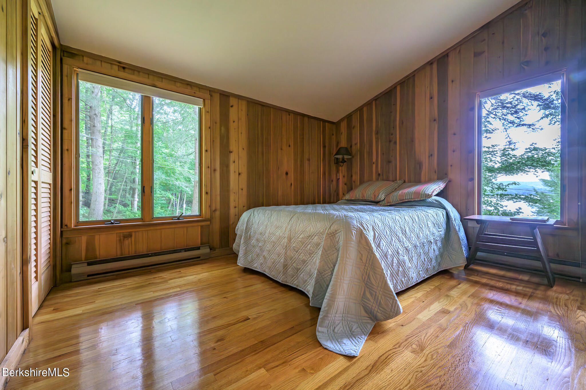 29 Lakeside Drive Tyringham, MA 01238 - Photo 18 of 31 a bedroom with a bed and a window