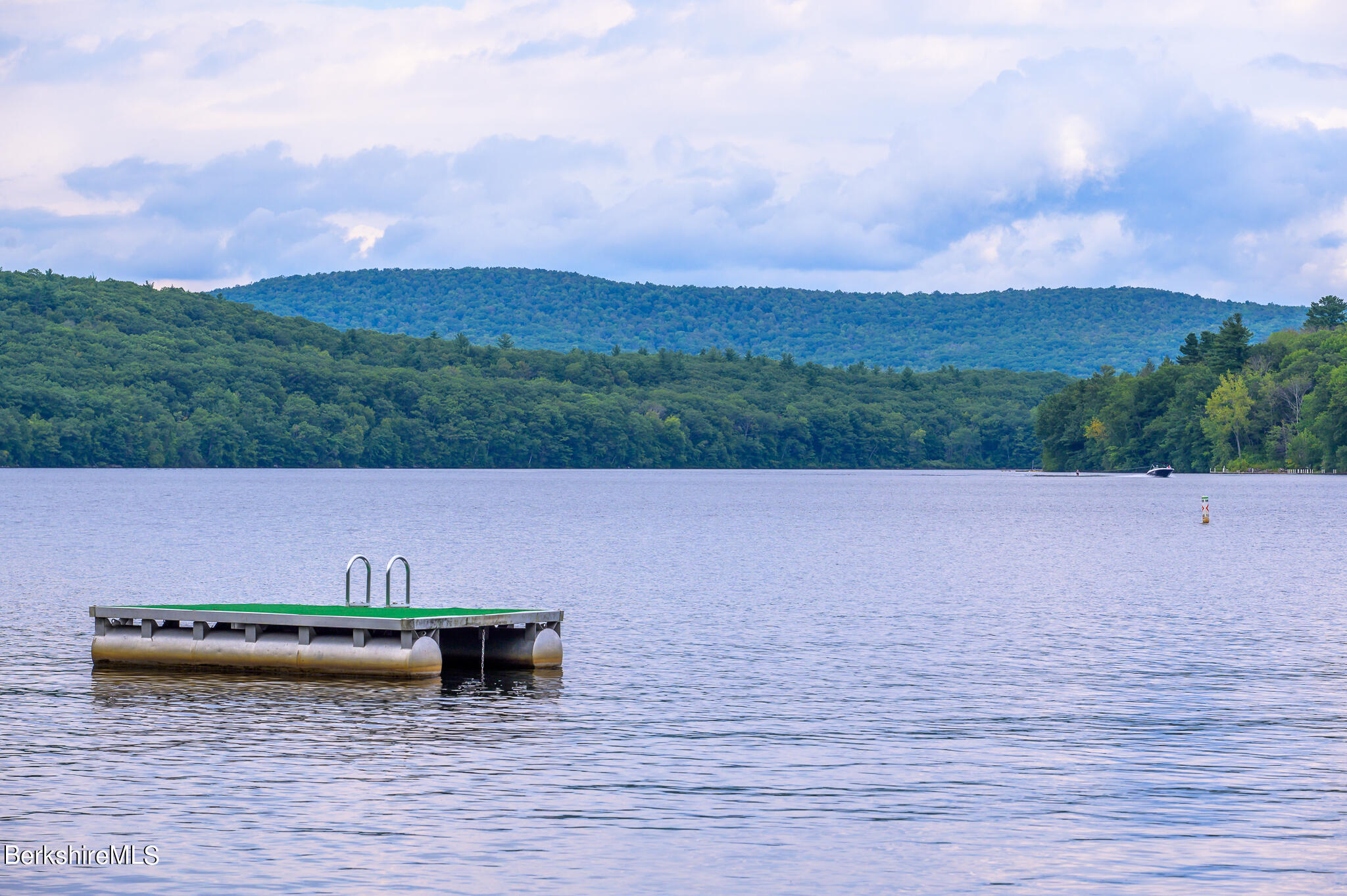29 Lakeside Drive Tyringham, MA 01238 - Photo 7 of 31 a view of a lake with houses in the background
