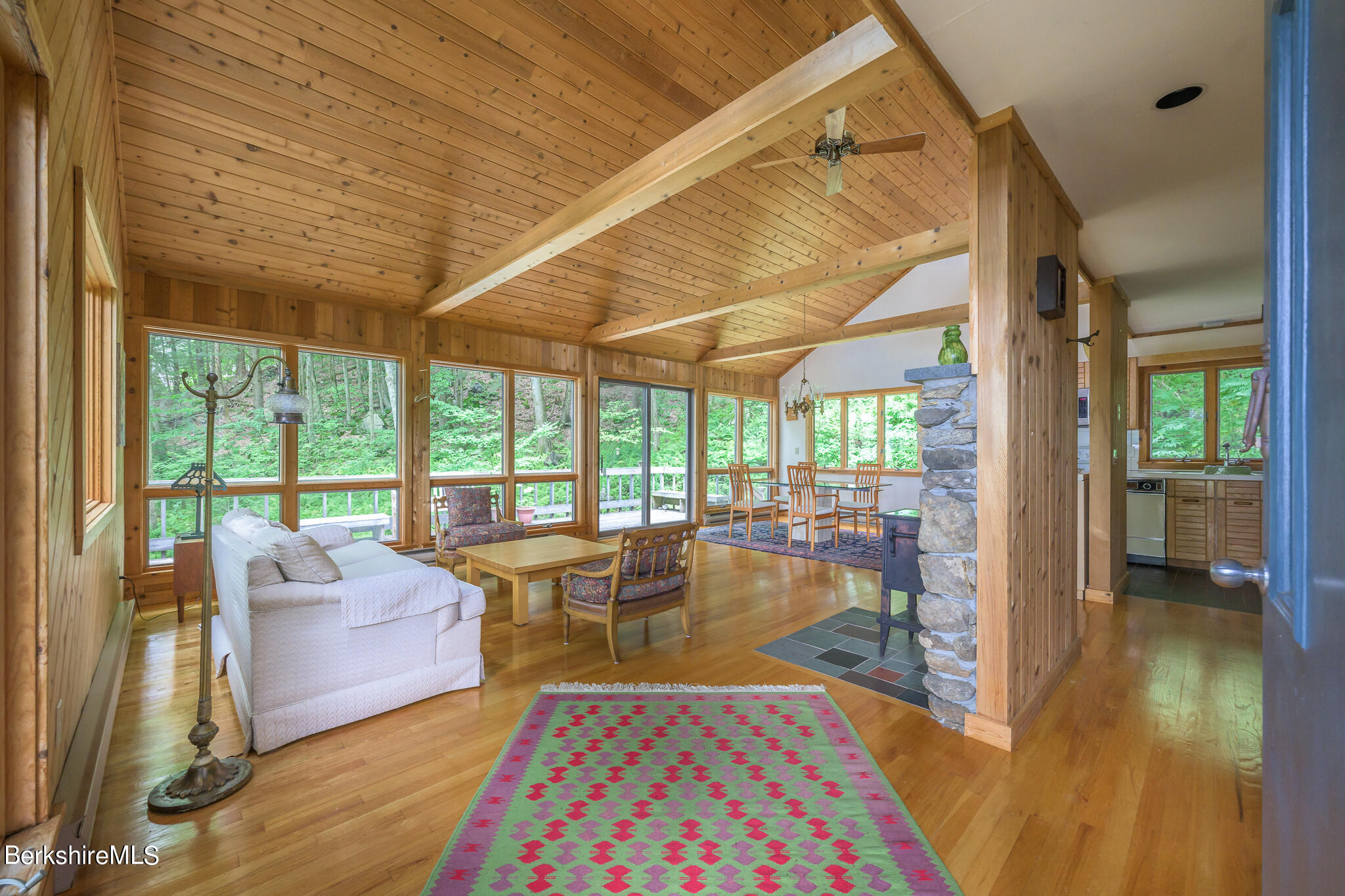 29 Lakeside Drive Tyringham, MA 01238 - Photo 9 of 31 a living room with furniture and a table