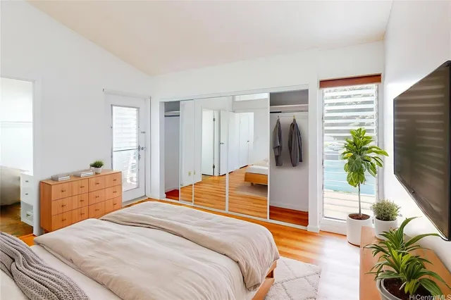 a bedroom with a bed and a couch