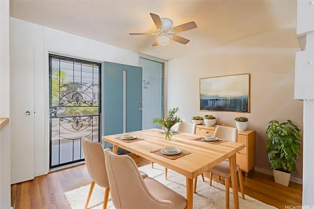 a dining room with furniture and window