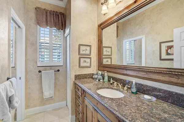 a view of a patio with table and chairs and potted plants