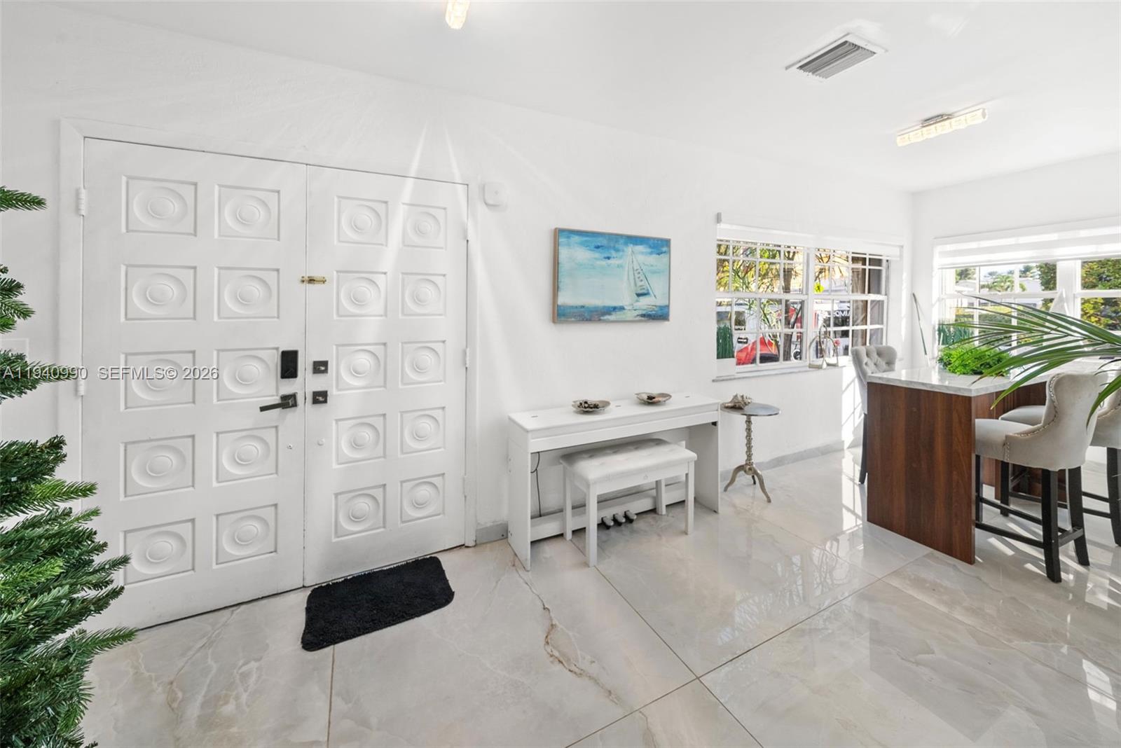 8918 Harding Avenue Surfside, FL 33154 - Photo 12 of 24 a view of a livingroom with furniture
