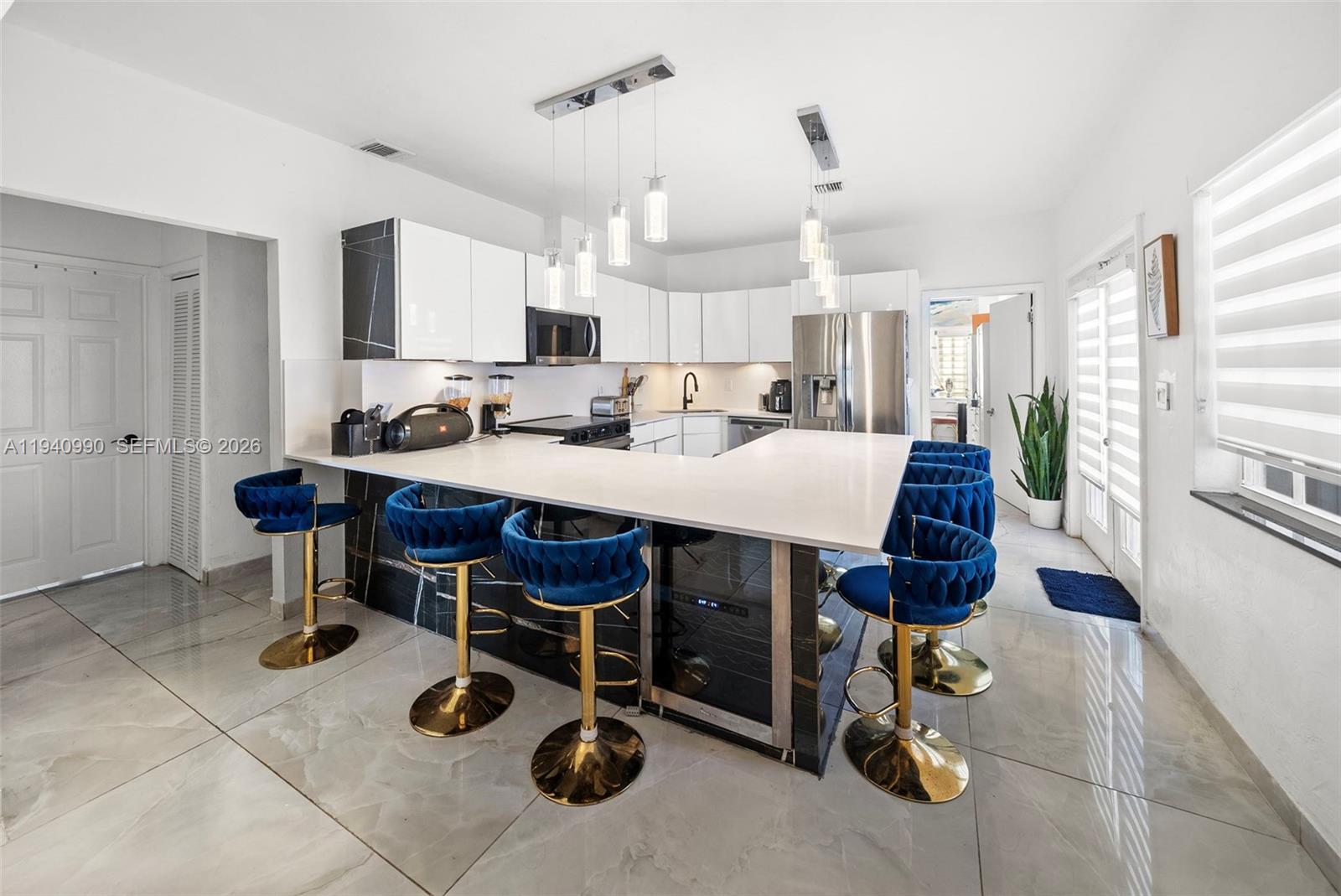 8918 Harding Avenue Surfside, FL 33154 - Photo 7 of 24 a view of a dining room with furniture