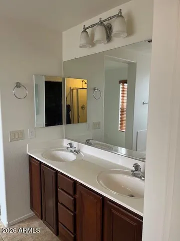 a bathroom with a sink and a mirror