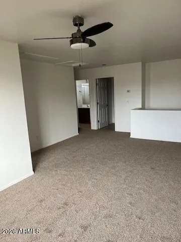 a view of a livingroom with a ceiling fan