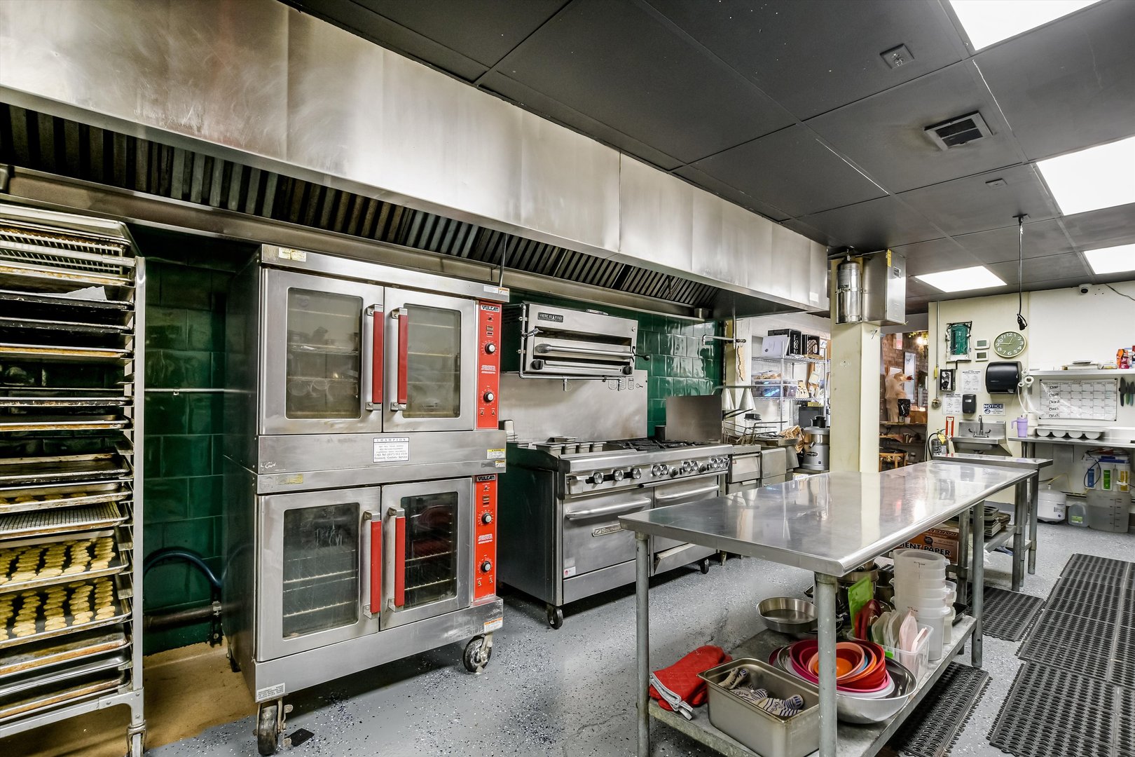 5481 North Northwest Highway Chicago, IL 60630 - Photo 11 of 60 a open kitchen with stainless steel appliances granite countertop a stove and cabinets