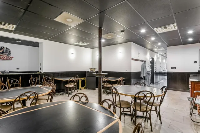 a kitchen with a table and chairs