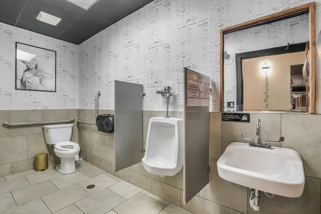 a view of a workspace with furniture window and wooden floor