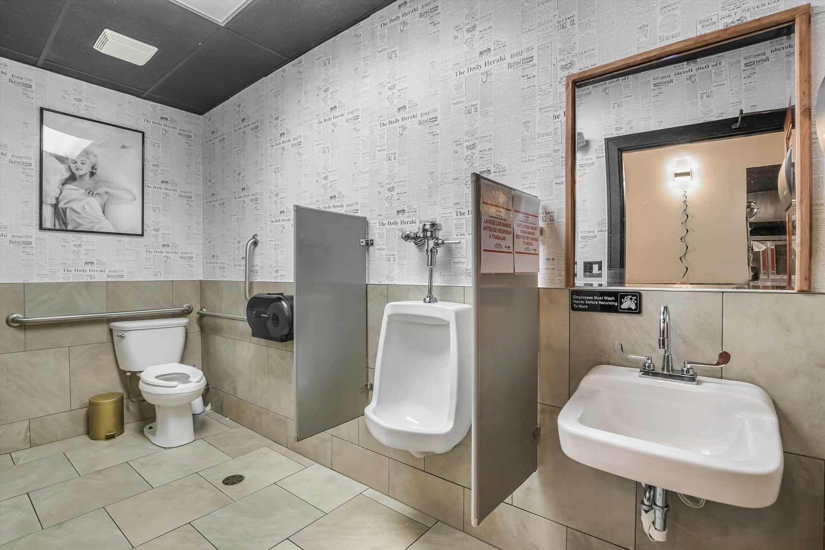 5481 North Northwest Highway Chicago, IL 60630 - Photo 17 of 60 a bathroom with a toilet sink and mirror