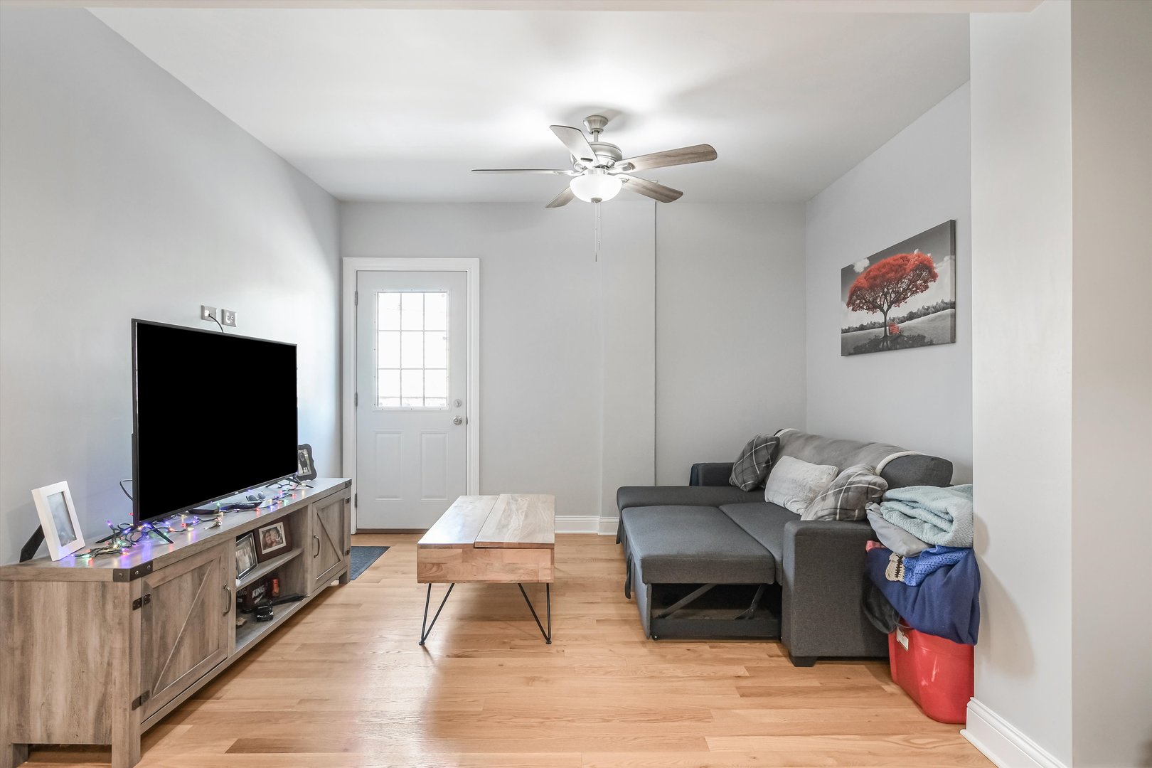 5481 North Northwest Highway Chicago, IL 60630 - Photo 20 of 60 a living room with furniture and a flat screen tv