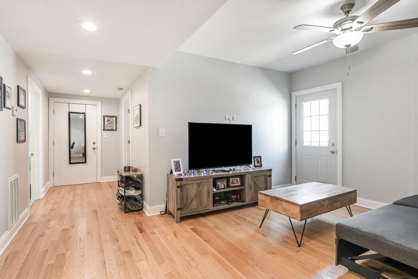 5481 North Northwest Highway Chicago, IL 60630 - Photo 24 of 60 a living room with furniture and a flat screen tv